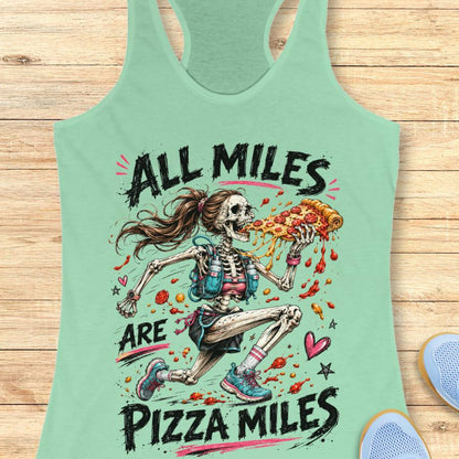 Mint green tank top with skeleton running and pizza design and text 'All Miles are Pizza Miles' on a wooden surface