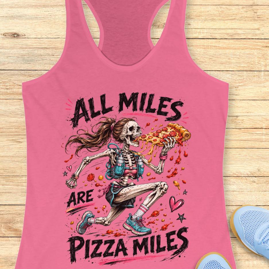 Pink tank top with skeleton holding a pizza and 'All Miles are Pizza Miles' text on a wooden surface.