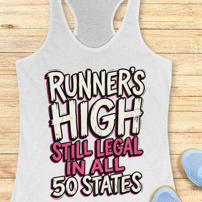 white tank top with 'Runner's High Still Legal in All 50 States' text on a wooden surface.