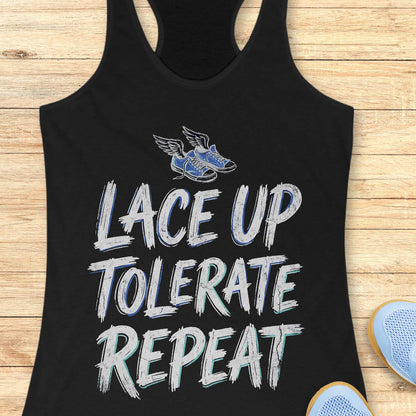 Black tank top with 'Lace Up Tolerate Repeat' text and running shoe graphic on a wooden surface.