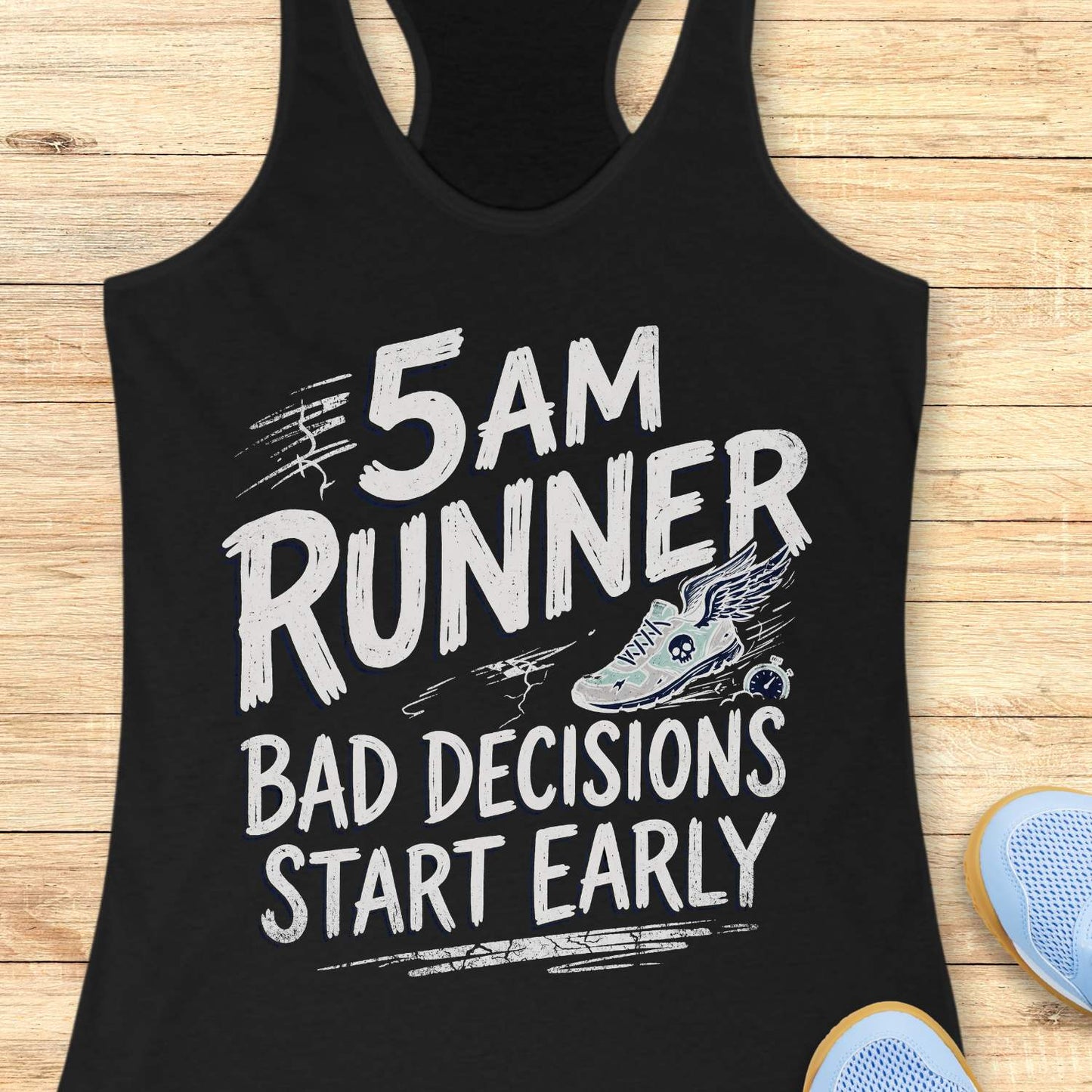 Black tank top with '5 AM Runner Bad Decisions Start Early' text and shoe graphic on a wooden surface.