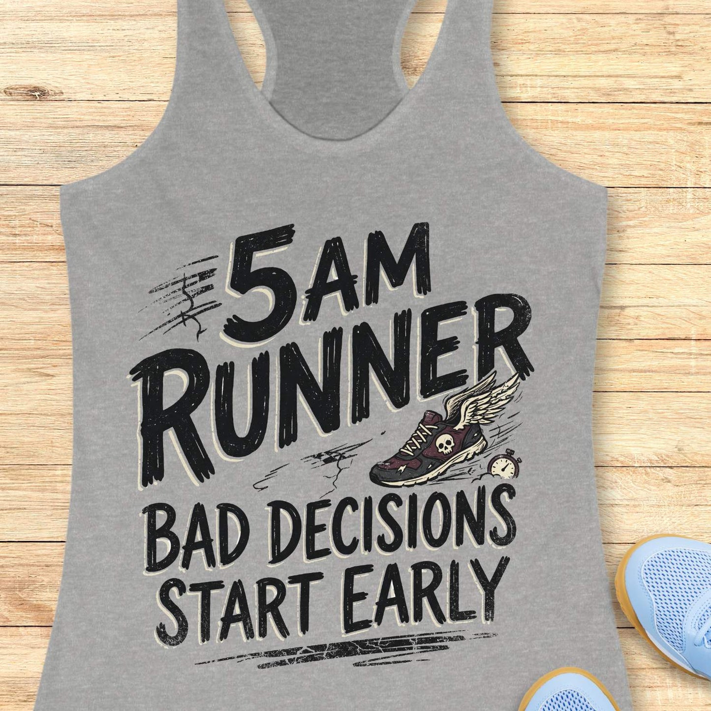 Gray tank top with '5 AM Runner Bad Decisions Start Early' text and graphic on a wooden surface.