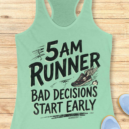 Mint green tank top with '5 AM Runner Bad Decisions Start Early' text on a wooden surface.