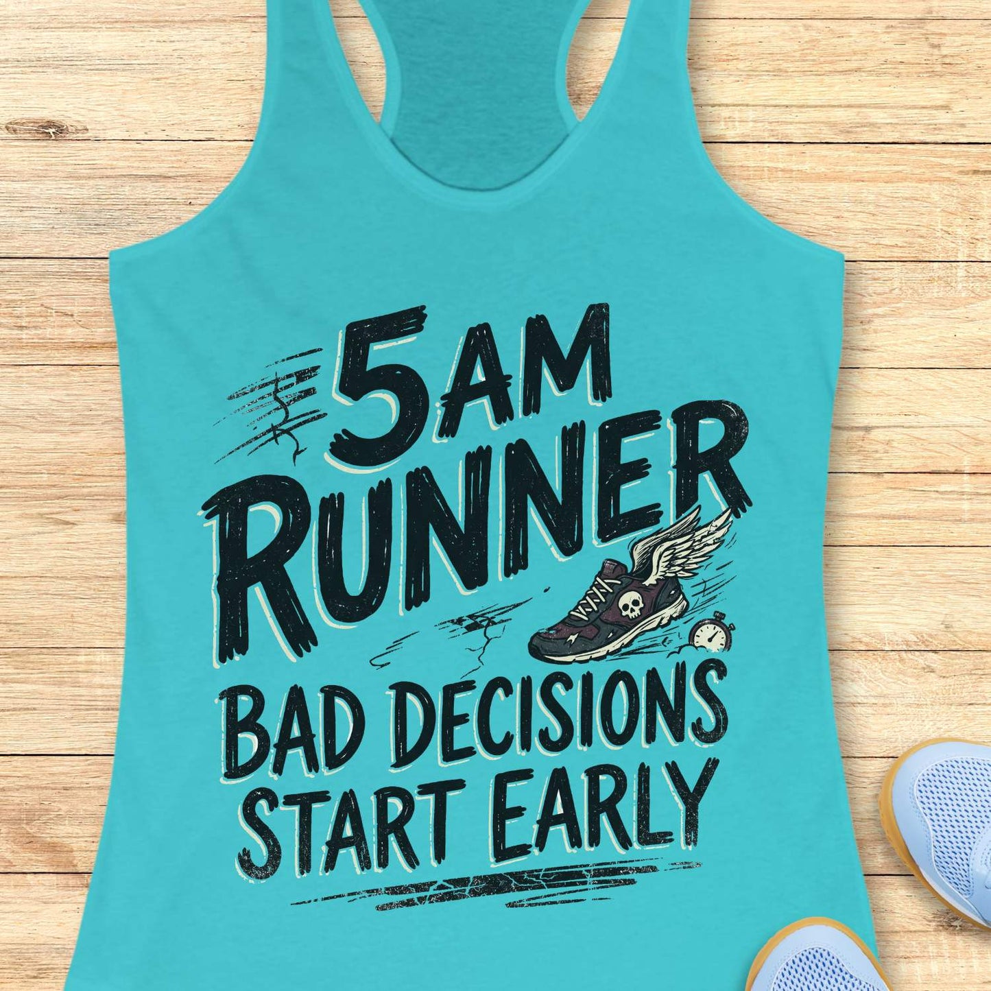 Turquoise tank top with '5 AM Runner bad decisions start early' text and shoe graphic on a wooden surface