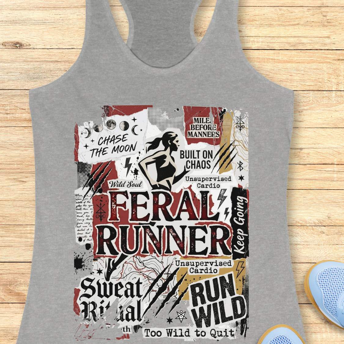 Gray tank top with graphic design on a wooden surface