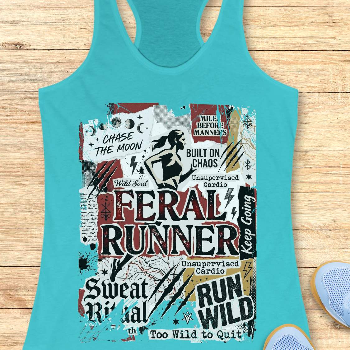 Turquoise tank top with graphic design and text on a wooden surface