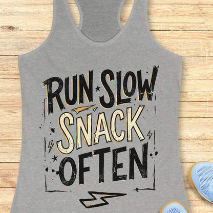 Gray tank top with 'Run Slow, Snack Often' text on a wooden surface