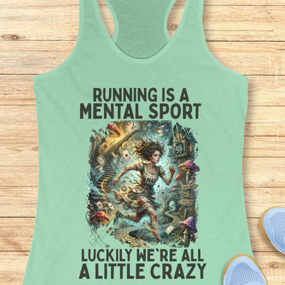 Mint green  tank top with graphic design and text 'Running is a mental sport luckily we're all a little crazy' on a wooden surface.