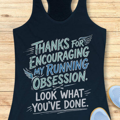 navy tank top with motivational text 'Thanks for encouraging my running obsession. Look what you've done.'  on a wooden surface