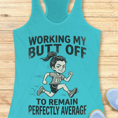 Turquoise tank top with a graphic of a runner and text  'working my butt off to remain perfectly average', on a wooden surface