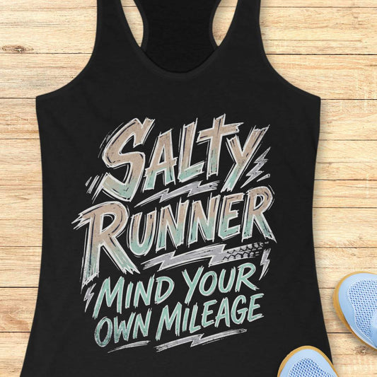 Black tank top with 'Salty Runner Mind Your Own Mileage' text on a wooden surface