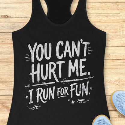 Black tank top with white text 'You can't hurt me. I run for fun.' on a wooden surface