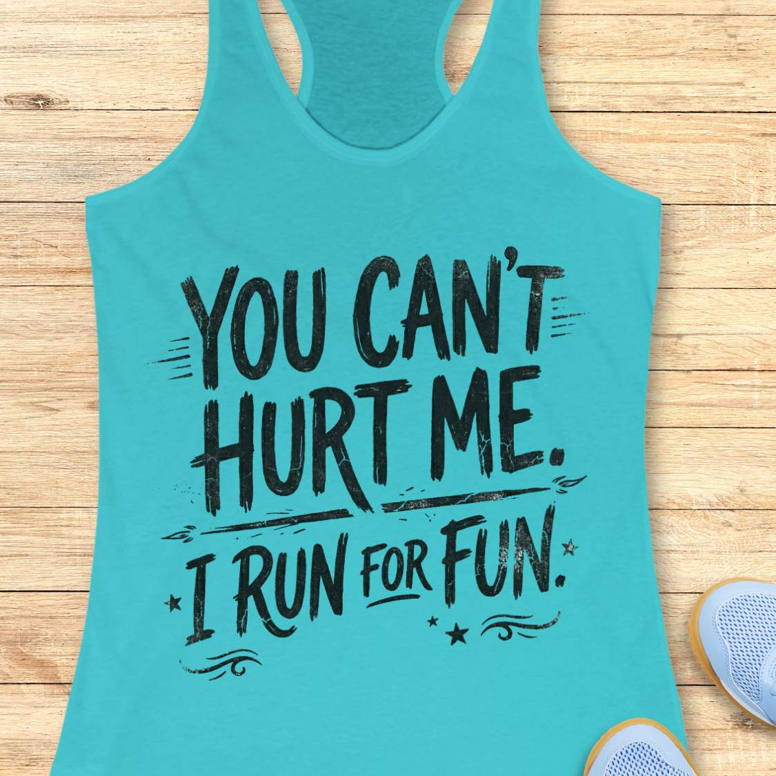 Turquoise tank top with motivational text 'You can't hurt me. I run for fun.' on a wooden surface