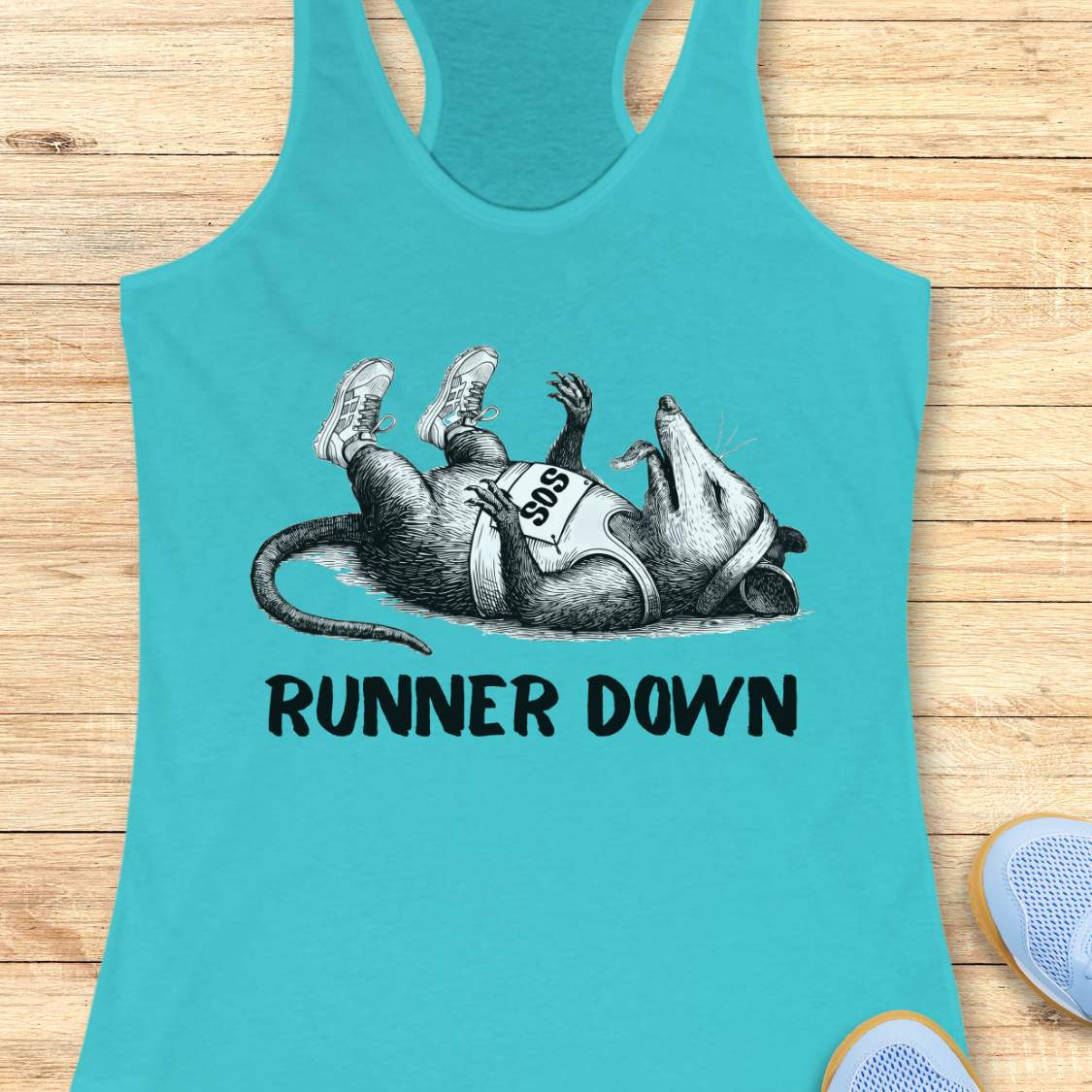 Turquoise tank top with armadillo graphic and 'Runner Down' text on a wooden surface