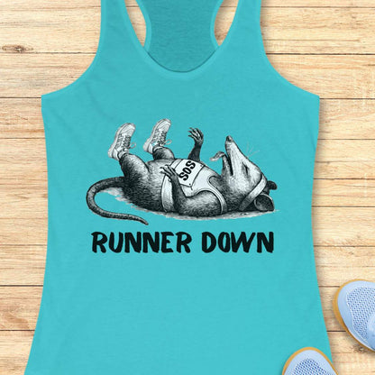 Turquoise tank top with armadillo graphic and 'Runner Down' text on a wooden surface