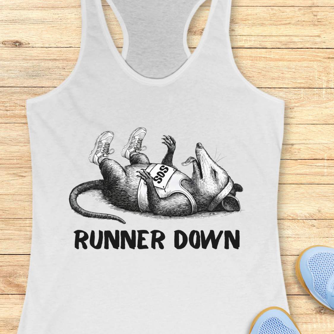 white tank top with a graphic of a rat wearing a marathon number and 'Runner Down' text on a wooden surface.