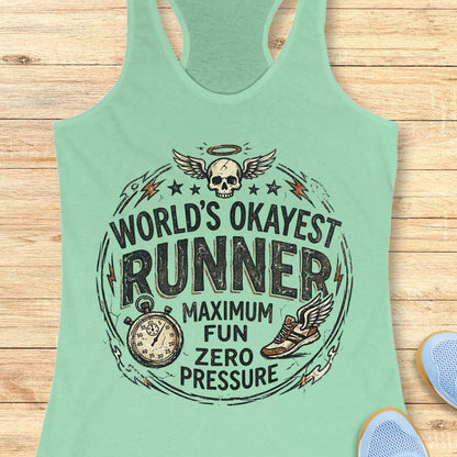 Mint green tank top with a graphic design and text -  'World's Okayest Runner maximum fun, zero pressure' on a wooden surface