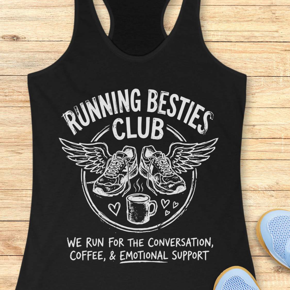 Black tank top with 'Running Besties Club' design on a wooden surface