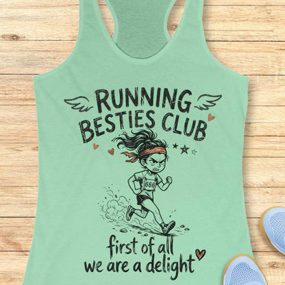 Mint green tank top with 'Running Besties Club' design on a wooden surface