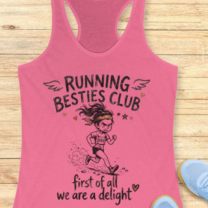 Pink tank top with 'Running Besties Club' design on a wooden surface