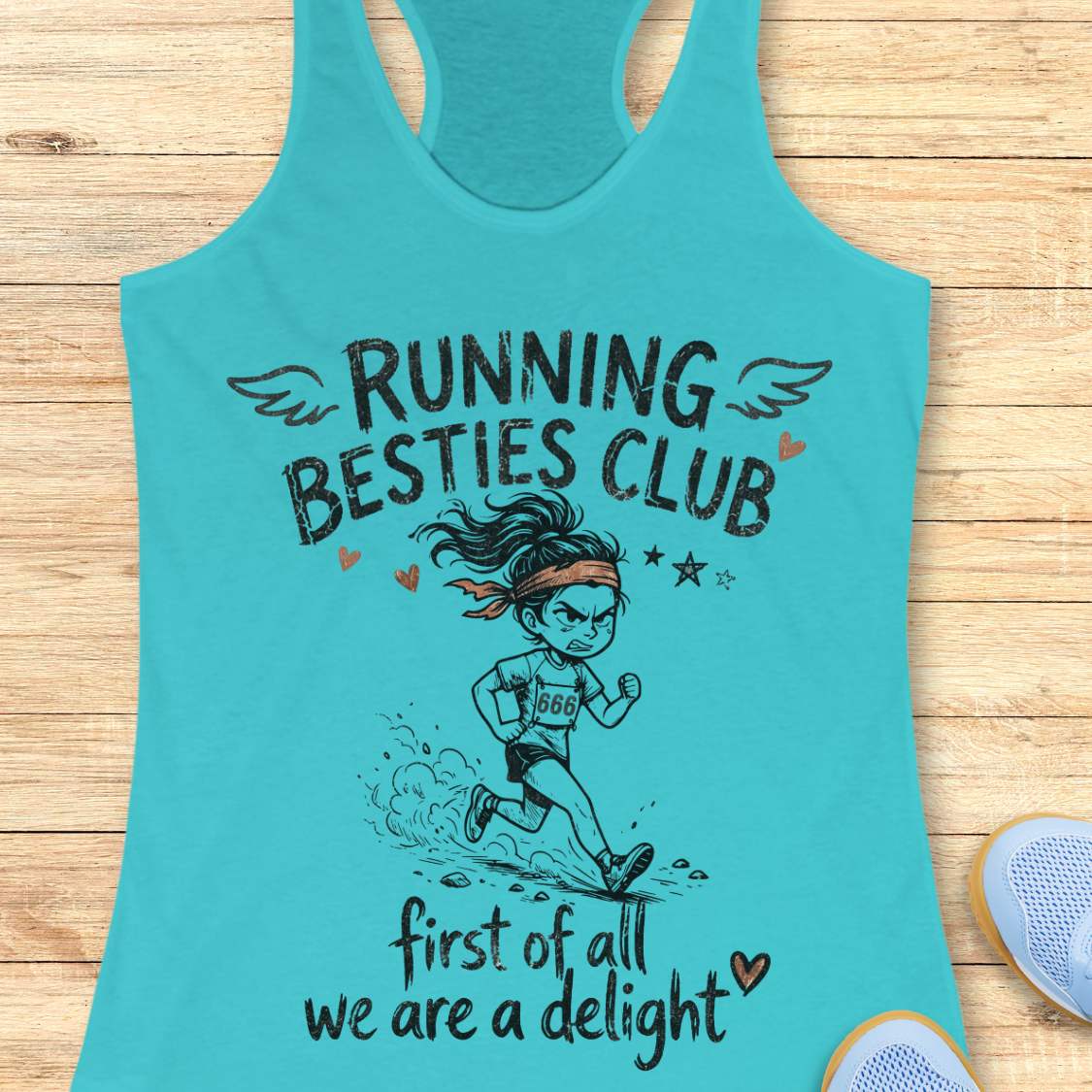 Turquoise tank top with 'Running Besties Club' design on a wooden surface