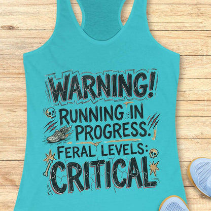 Turquoise tank top with humorous text 'warning running in progress, feral levels critical' , design on a wooden surface