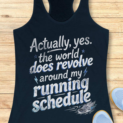 Navy tank top with funny text 'Actually, yes. the world does revolve around my running schedule.',  on a wooden surface
