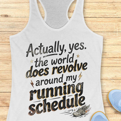 white tank top with funny text 'Actually, yes. the world does revolve around my running schedule.',  on a wooden surface