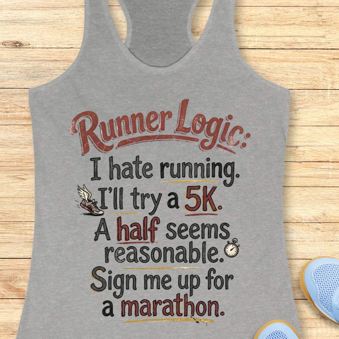 Gray tank top with 'Runner Logic' text on a wooden surface