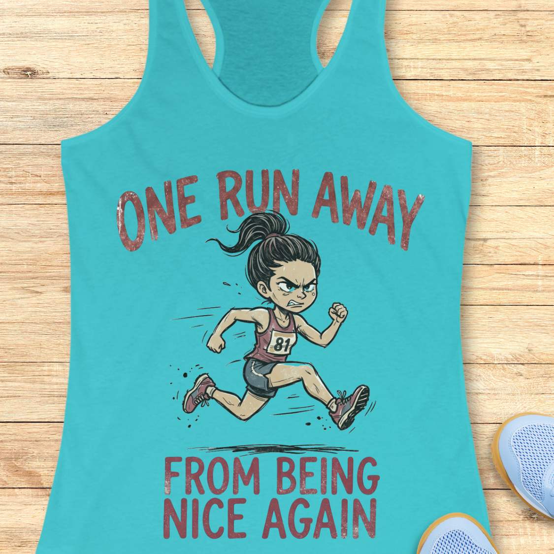 Turquoise tank top with a graphic of a runner and text 'one run away from being nice again',  on a wooden surface