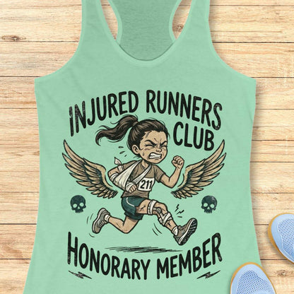 Mint green tank top with 'Injured Runners Club Honorary Member' graphic on a wooden surface.
