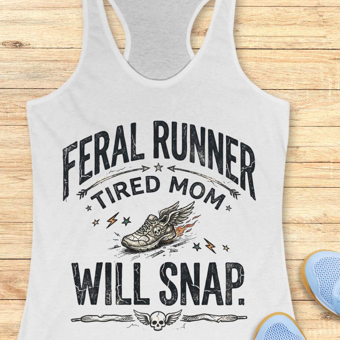 white tank top with 'Feral Runner Tired Mom Will Snap' text on a wooden surface.