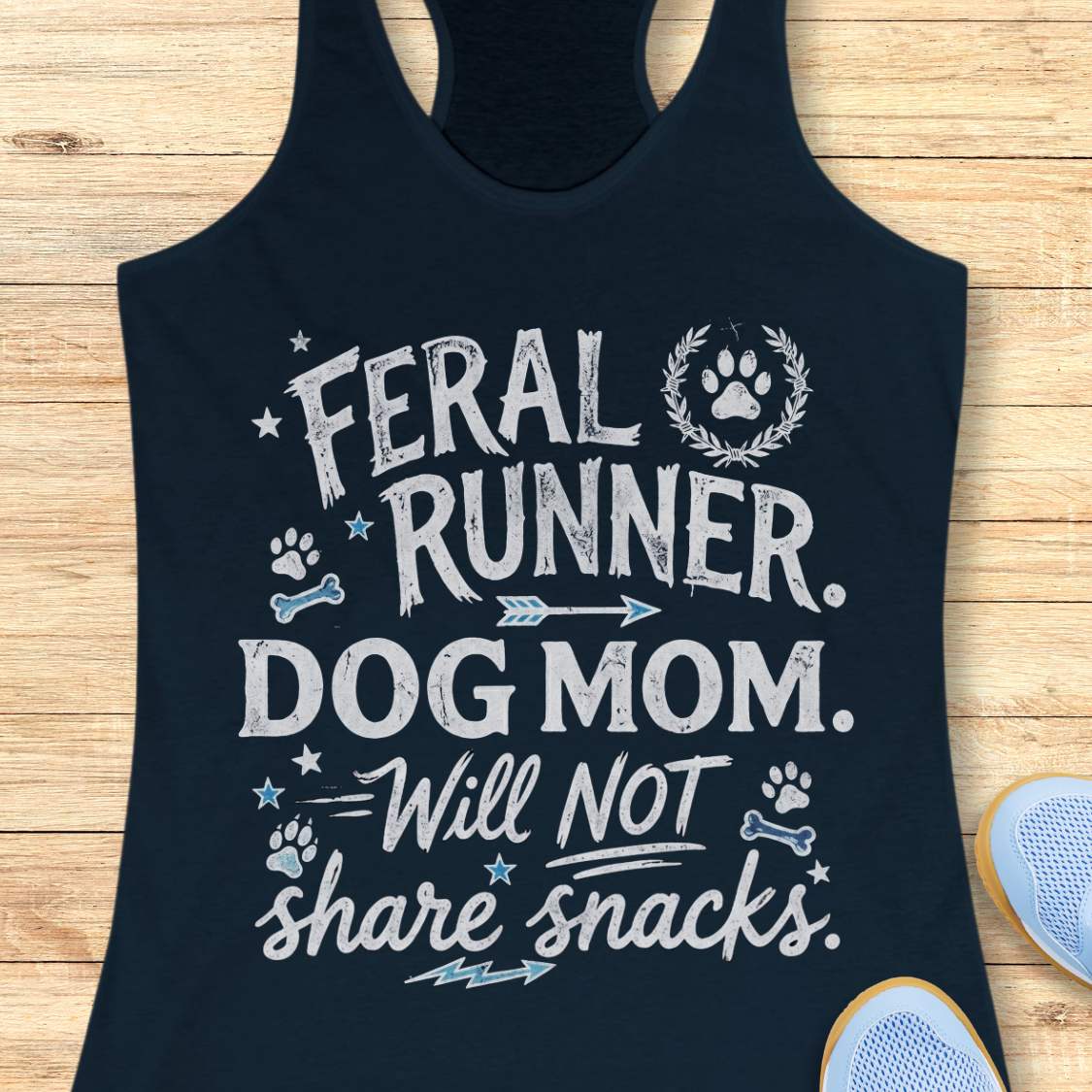 navy tank top with white text and graphics on a wooden surface