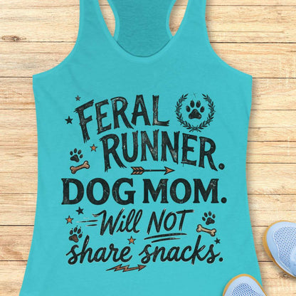 Turquoise tank top with text 'Feral Runner. Dog Mom. Will Not Share Snacks.' on a wooden surface.