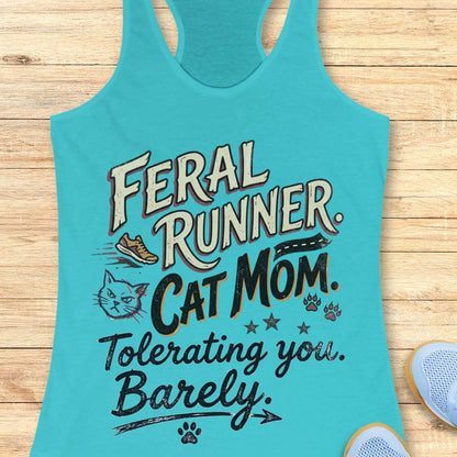 Turquoise tank top with text 'Feral Runner, Cat Mom, Tolerating you, Barely' on a wooden surface.