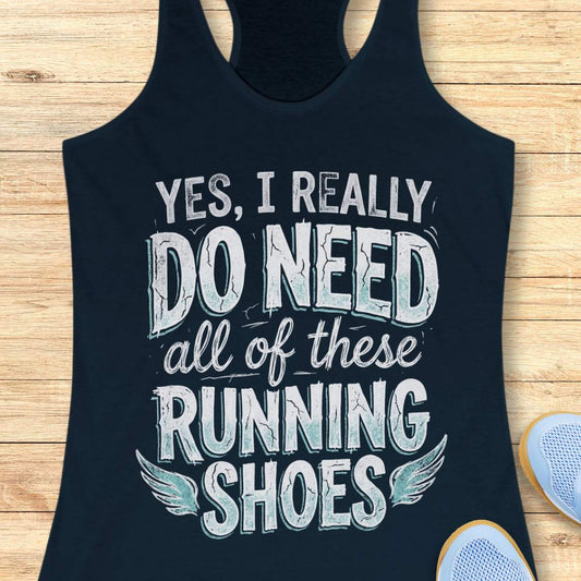 navy tank top with text 'Yes, I really do need all of these running shoes' on a wooden surface.