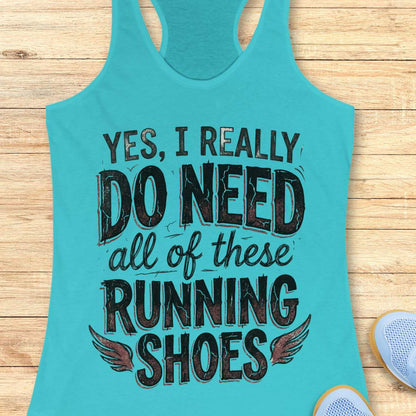 Turquoise tank top with text ' yes, I really do need all of these running shoes', on a wooden surface