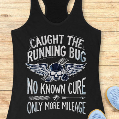 Black tank top with skull and text 'caught the running bug. no known cure. only more mileage', design on a wooden surface