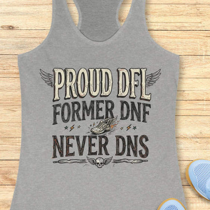 Gray tank top with text 'Proud DFL, former DNF, never DNS', design on a wooden surface