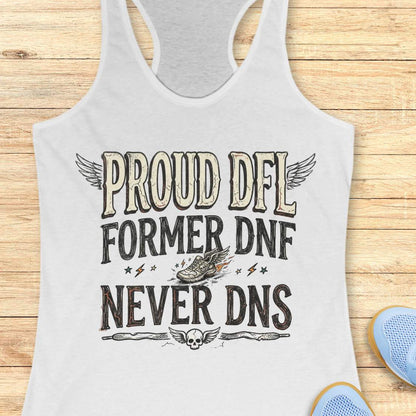 white tank top with text 'Proud DFL, former DNF, never DNS', on a wooden surface