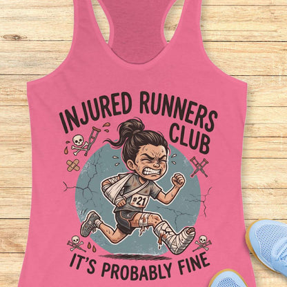 Pink tank top with 'Injured Runners Club' graphic on a wooden surface