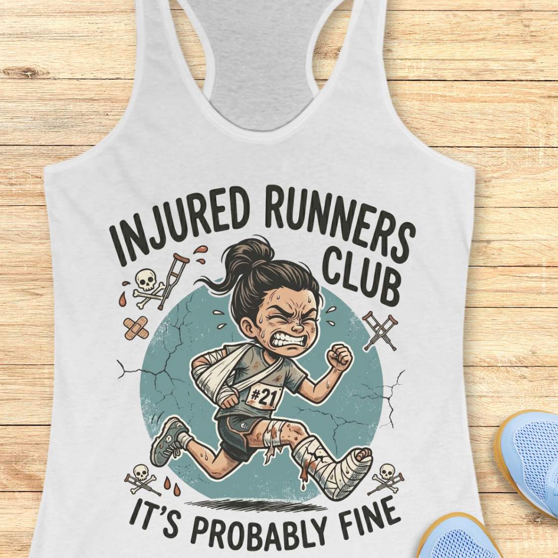 white tank top with 'Injured Runners Club' graphic on a wooden surface