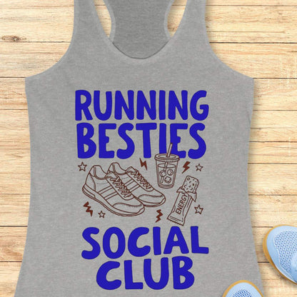 Gray tank top with 'Running Besties Social Club' text and graphics on a wooden surface