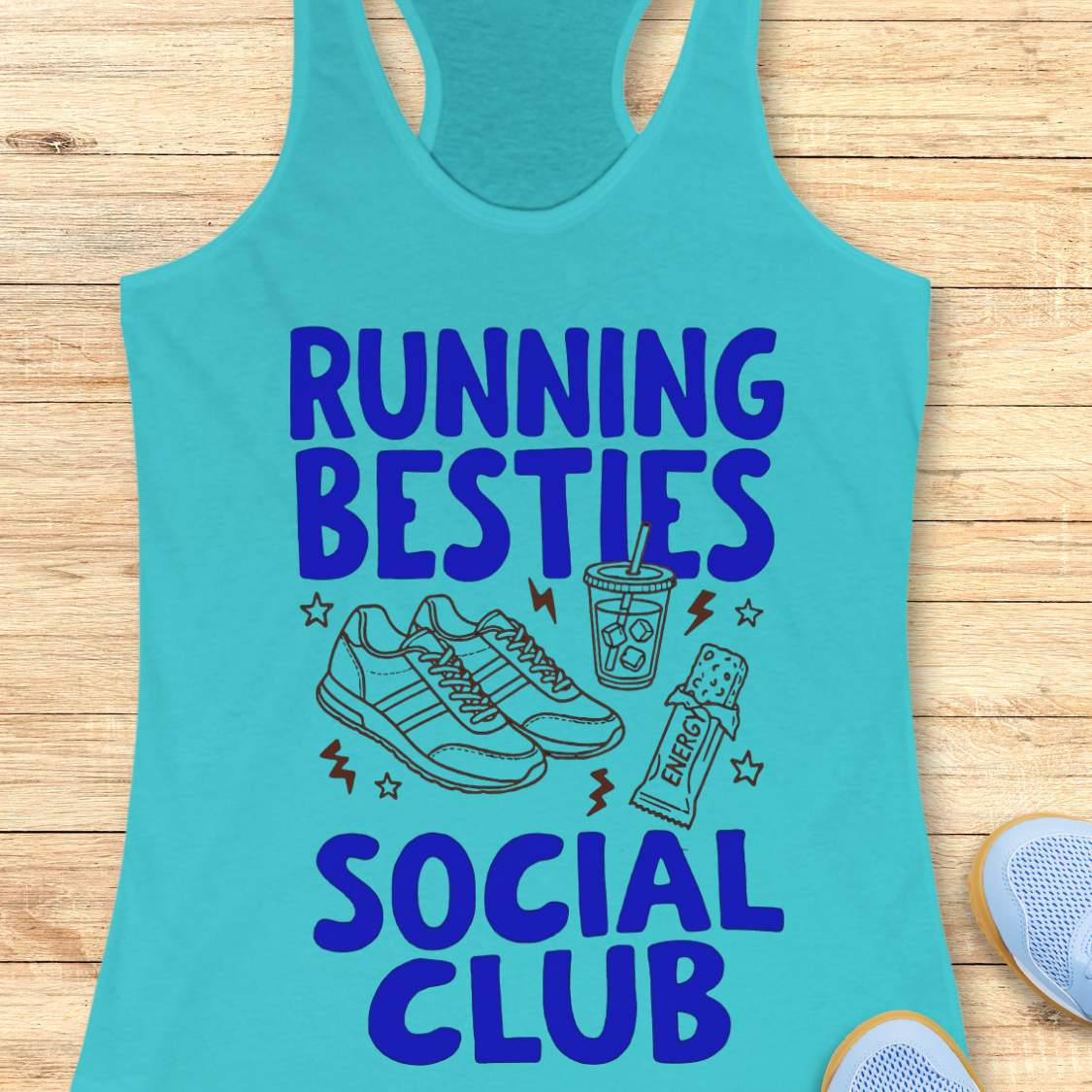 Turquoise tank top with 'Running Besties Social Club' text and graphics on a wooden surface.