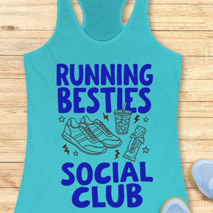 Turquoise tank top with 'Running Besties Social Club' text and graphics on a wooden surface.