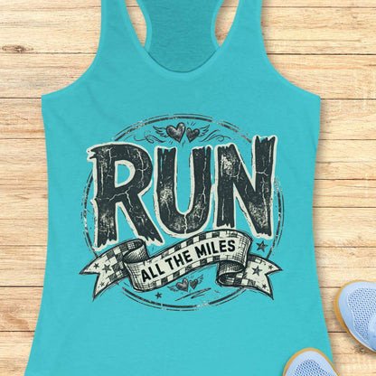 Turquoise tank top with 'RUN ALL THE MILES' text on a wooden surface