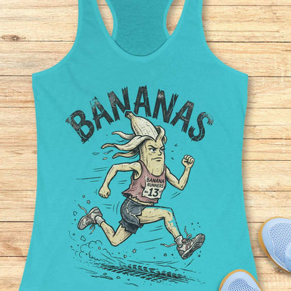 Turquoise tank top with cartoon banana character and 'BANANAS' text on a wooden surface