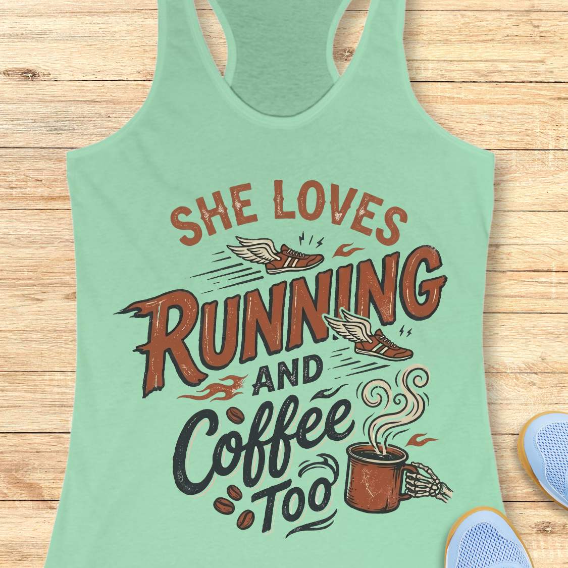 Mint green tank top with 'She loves running and coffee too' text on a wooden surface.