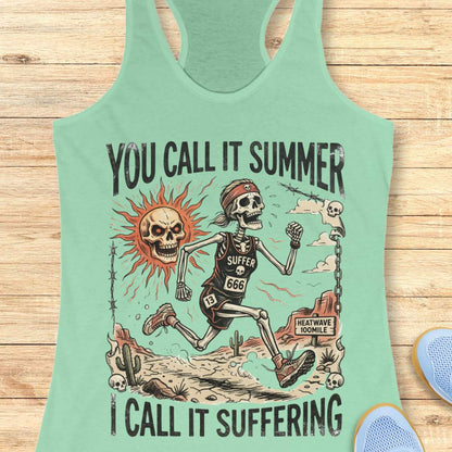Mint green tank top with skeleton graphic and text 'you call it summer, I call it suffering',  on a wooden surface