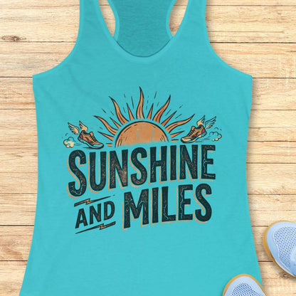 Turquoise tank top with 'Sunshine and Miles' text and sun design on a wooden surface